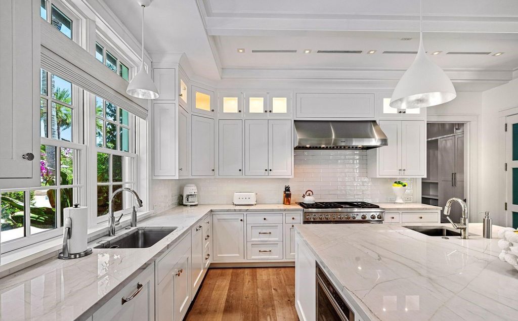 Indulge in luxurious coastal living at 156 Seagate, a meticulously designed haven nestled on Palm Beach Island's coveted North End.