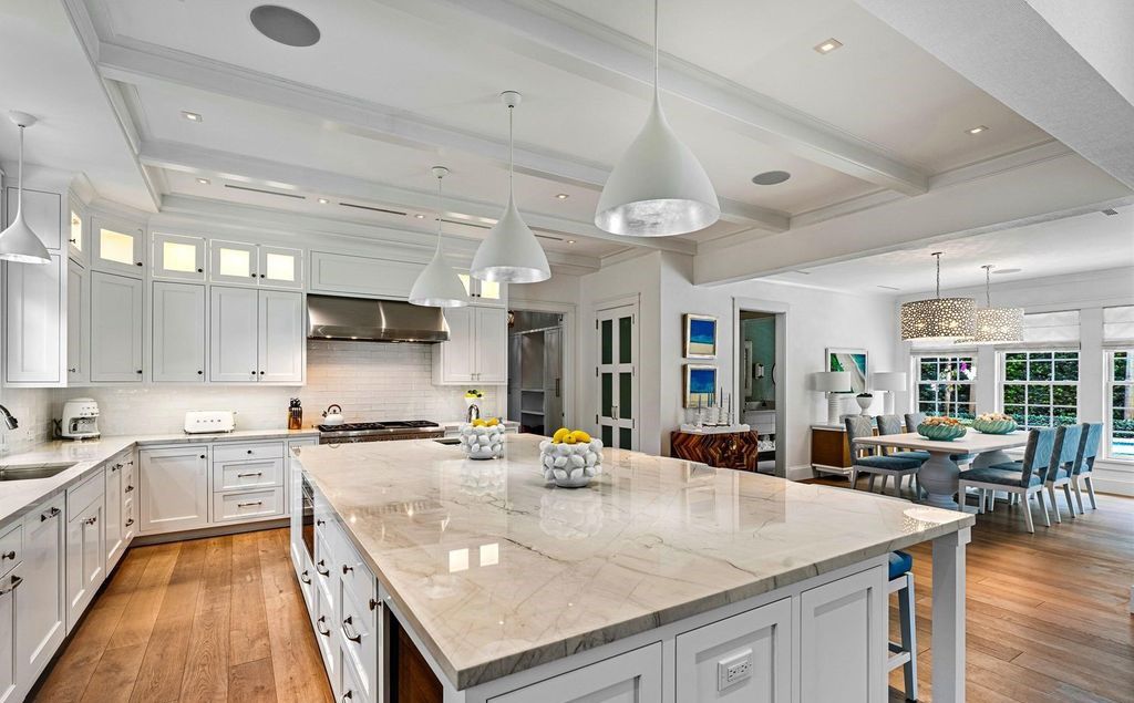 Indulge in luxurious coastal living at 156 Seagate, a meticulously designed haven nestled on Palm Beach Island's coveted North End.
