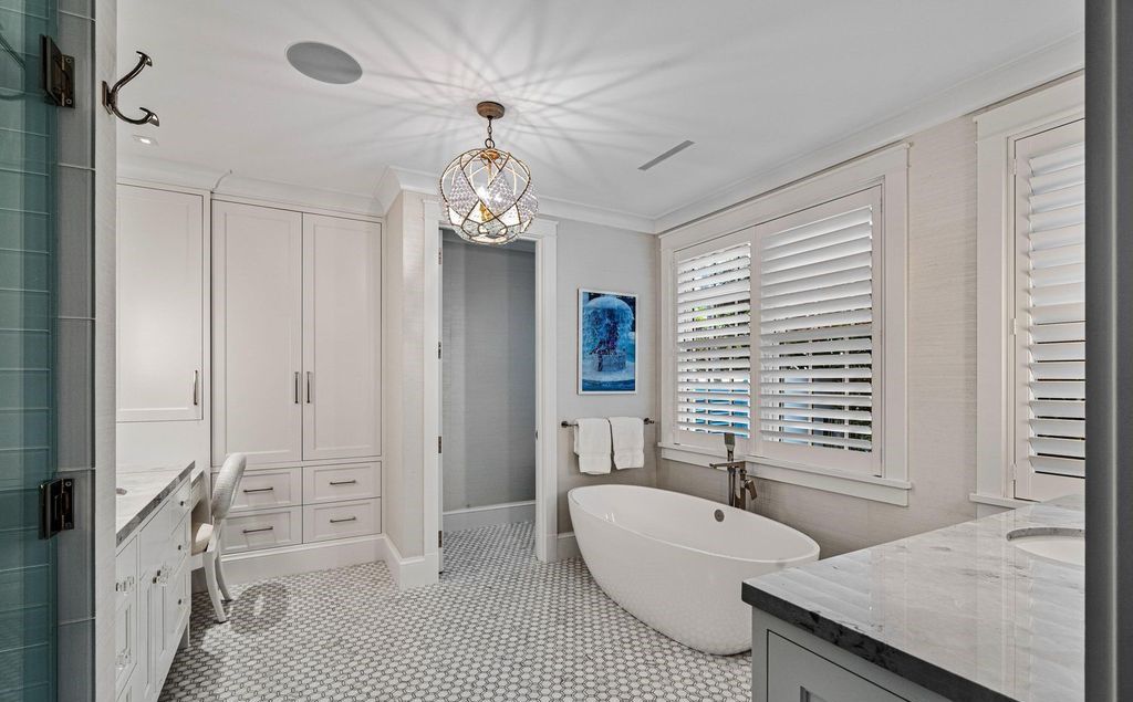 Indulge in luxurious coastal living at 156 Seagate, a meticulously designed haven nestled on Palm Beach Island's coveted North End.