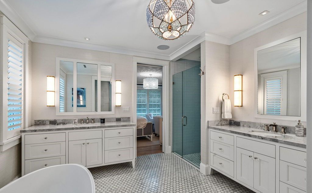 Indulge in luxurious coastal living at 156 Seagate, a meticulously designed haven nestled on Palm Beach Island's coveted North End.