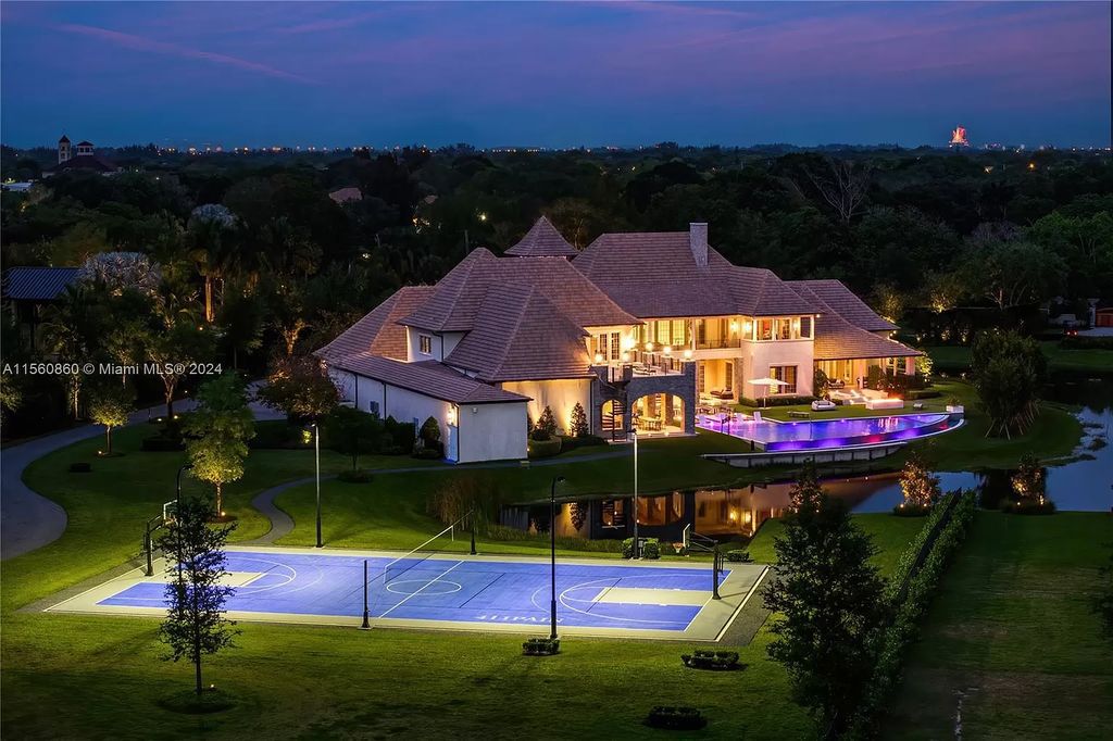 Indulge in the pinnacle of luxury with this custom French Country style mansion in Southwest Ranches, boasting over 15,000 square feet of meticulously crafted living space.