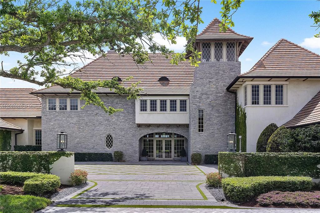 Indulge in the pinnacle of luxury with this custom French Country style mansion in Southwest Ranches, boasting over 15,000 square feet of meticulously crafted living space.