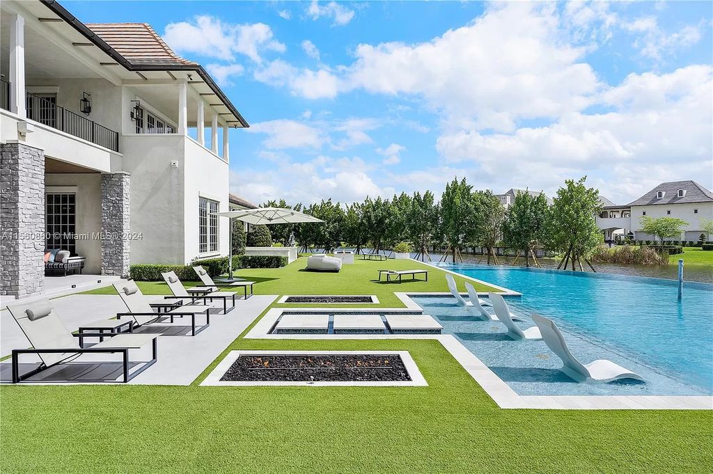 Indulge in the pinnacle of luxury with this custom French Country style mansion in Southwest Ranches, boasting over 15,000 square feet of meticulously crafted living space.