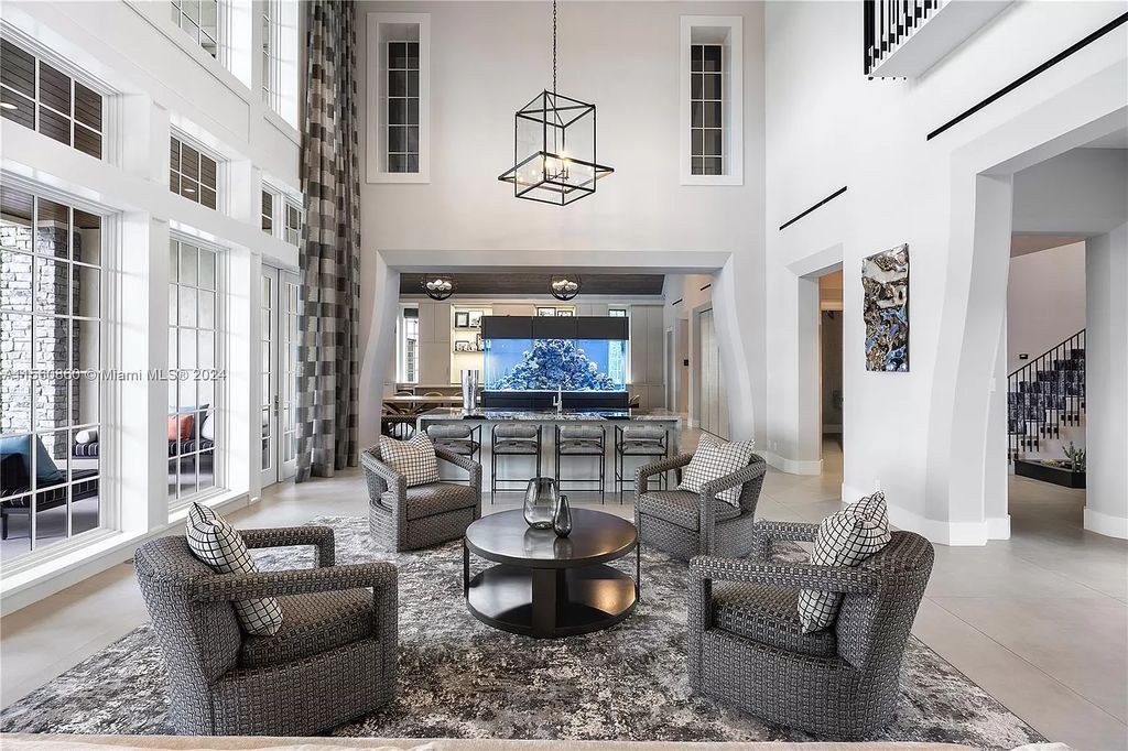 Indulge in the pinnacle of luxury with this custom French Country style mansion in Southwest Ranches, boasting over 15,000 square feet of meticulously crafted living space.
