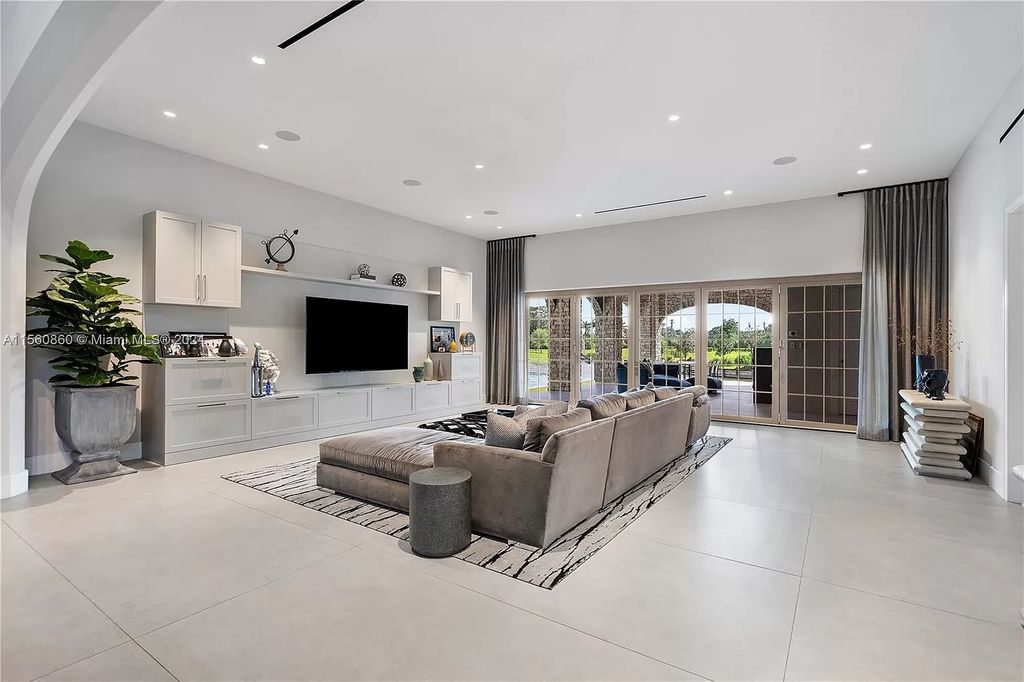 Indulge in the pinnacle of luxury with this custom French Country style mansion in Southwest Ranches, boasting over 15,000 square feet of meticulously crafted living space.