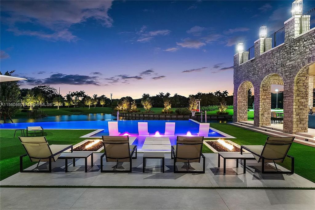 Indulge in the pinnacle of luxury with this custom French Country style mansion in Southwest Ranches, boasting over 15,000 square feet of meticulously crafted living space.