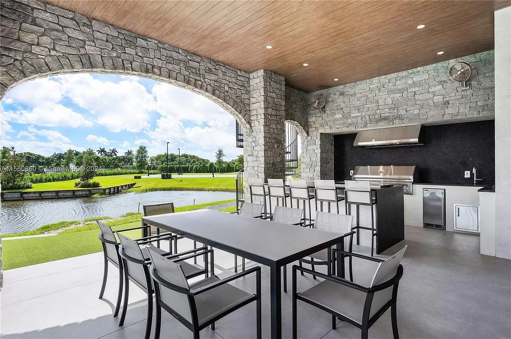 Indulge in the pinnacle of luxury with this custom French Country style mansion in Southwest Ranches, boasting over 15,000 square feet of meticulously crafted living space.