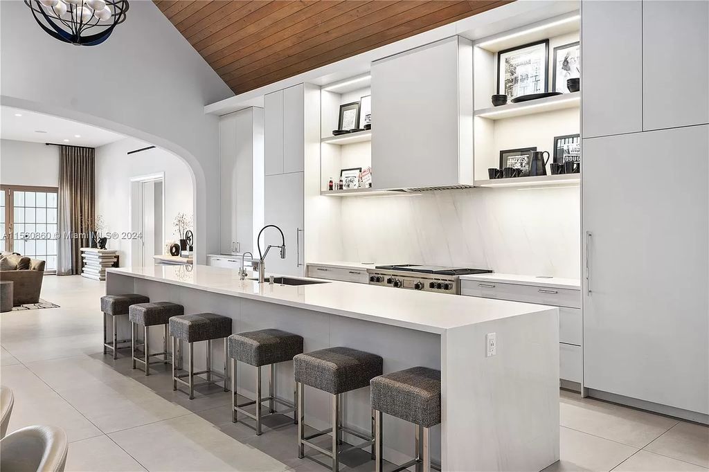 Indulge in the pinnacle of luxury with this custom French Country style mansion in Southwest Ranches, boasting over 15,000 square feet of meticulously crafted living space.
