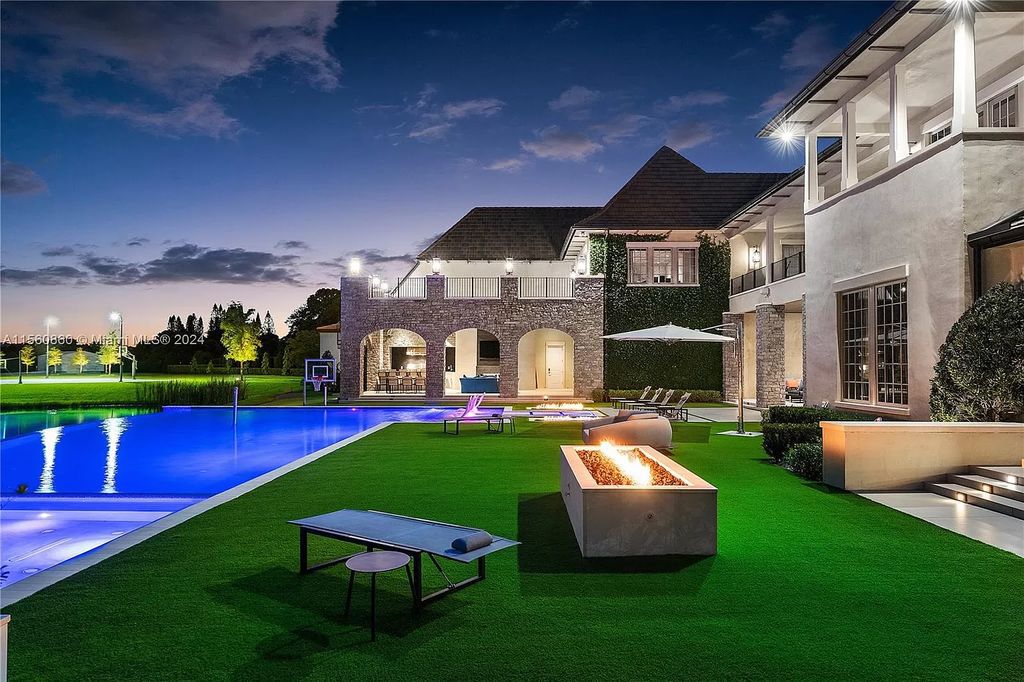 Indulge in the pinnacle of luxury with this custom French Country style mansion in Southwest Ranches, boasting over 15,000 square feet of meticulously crafted living space.