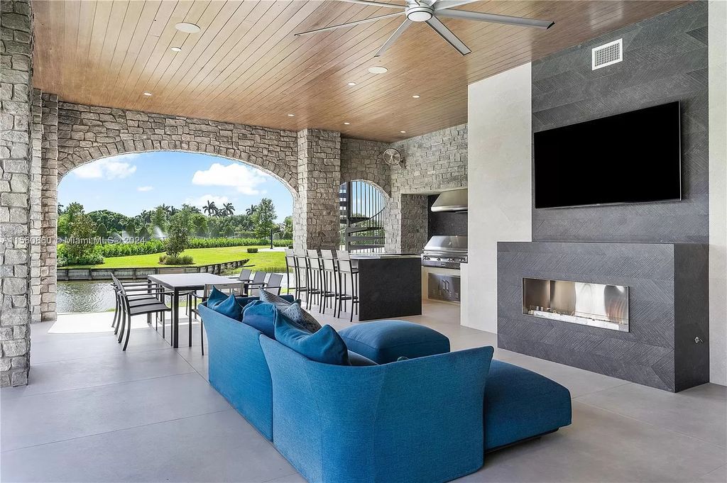 Indulge in the pinnacle of luxury with this custom French Country style mansion in Southwest Ranches, boasting over 15,000 square feet of meticulously crafted living space.