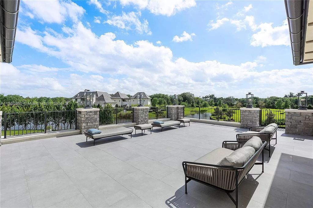 Indulge in the pinnacle of luxury with this custom French Country style mansion in Southwest Ranches, boasting over 15,000 square feet of meticulously crafted living space.