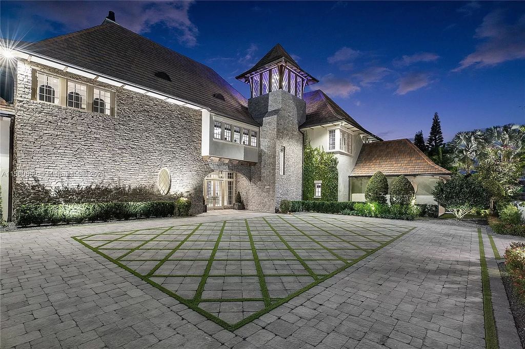 Indulge in the pinnacle of luxury with this custom French Country style mansion in Southwest Ranches, boasting over 15,000 square feet of meticulously crafted living space.
