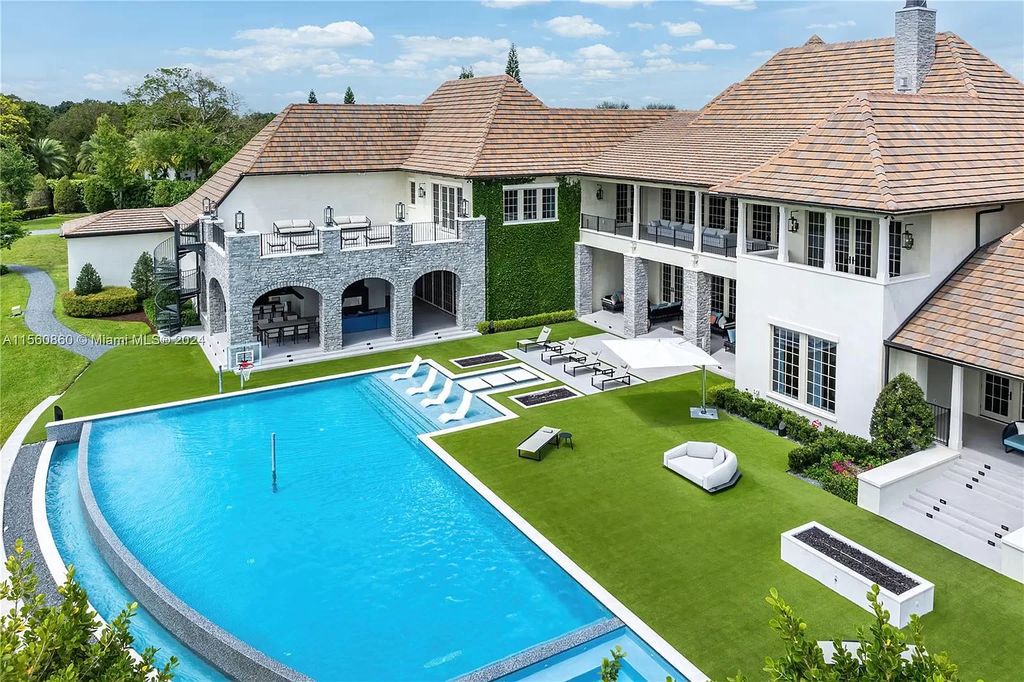 Indulge in the pinnacle of luxury with this custom French Country style mansion in Southwest Ranches, boasting over 15,000 square feet of meticulously crafted living space.