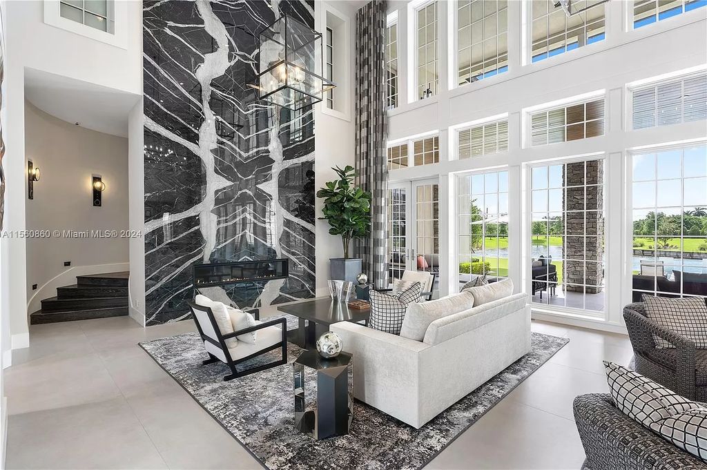 Indulge in the pinnacle of luxury with this custom French Country style mansion in Southwest Ranches, boasting over 15,000 square feet of meticulously crafted living space.