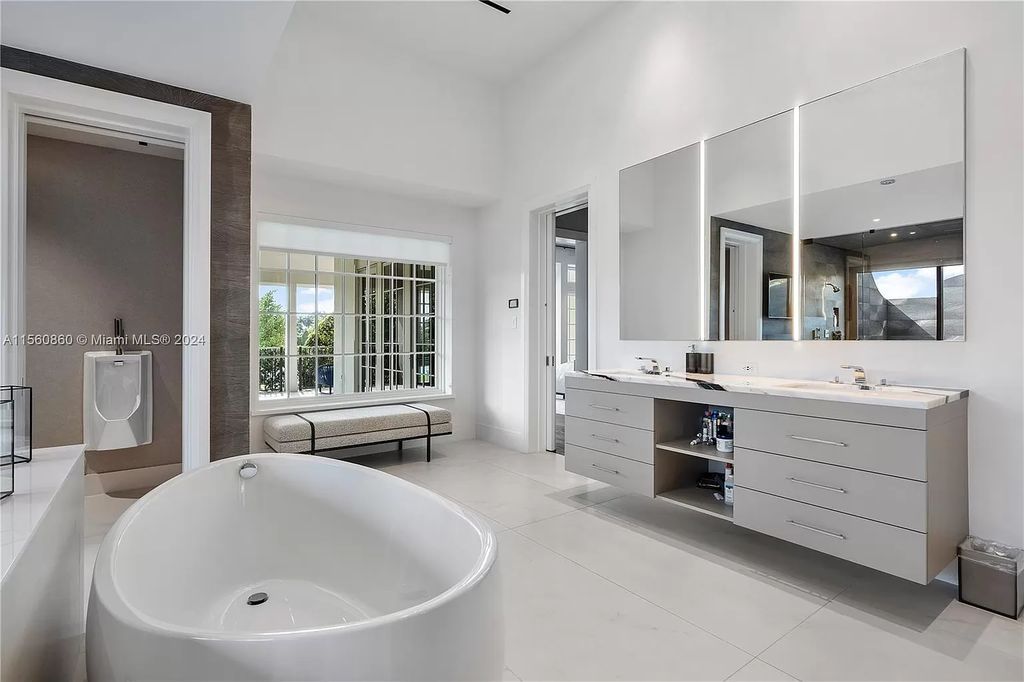 Indulge in the pinnacle of luxury with this custom French Country style mansion in Southwest Ranches, boasting over 15,000 square feet of meticulously crafted living space.