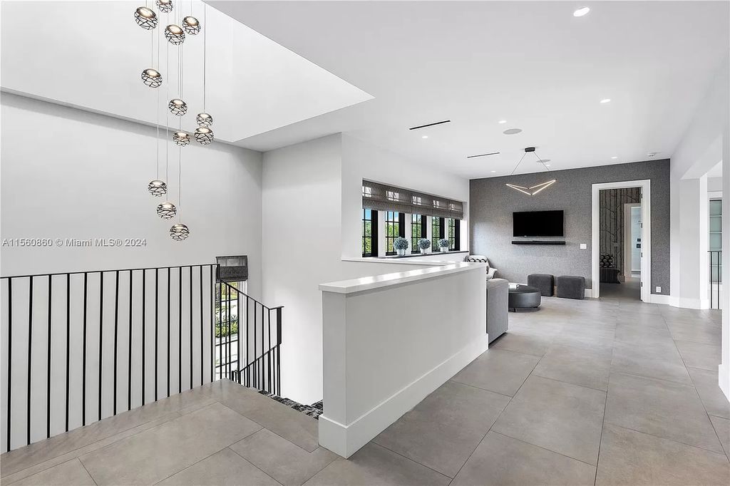 Indulge in the pinnacle of luxury with this custom French Country style mansion in Southwest Ranches, boasting over 15,000 square feet of meticulously crafted living space.