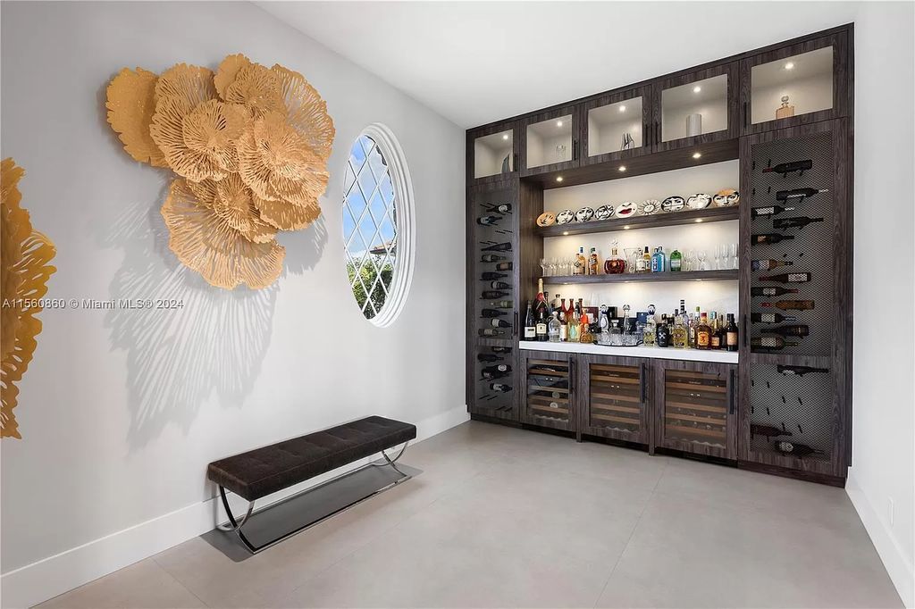Indulge in the pinnacle of luxury with this custom French Country style mansion in Southwest Ranches, boasting over 15,000 square feet of meticulously crafted living space.