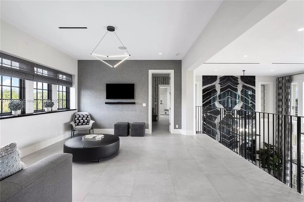 Indulge in the pinnacle of luxury with this custom French Country style mansion in Southwest Ranches, boasting over 15,000 square feet of meticulously crafted living space.