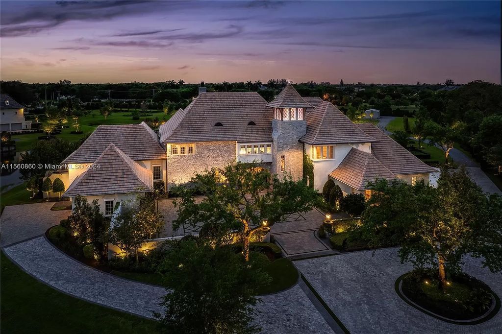 Indulge in the pinnacle of luxury with this custom French Country style mansion in Southwest Ranches, boasting over 15,000 square feet of meticulously crafted living space.