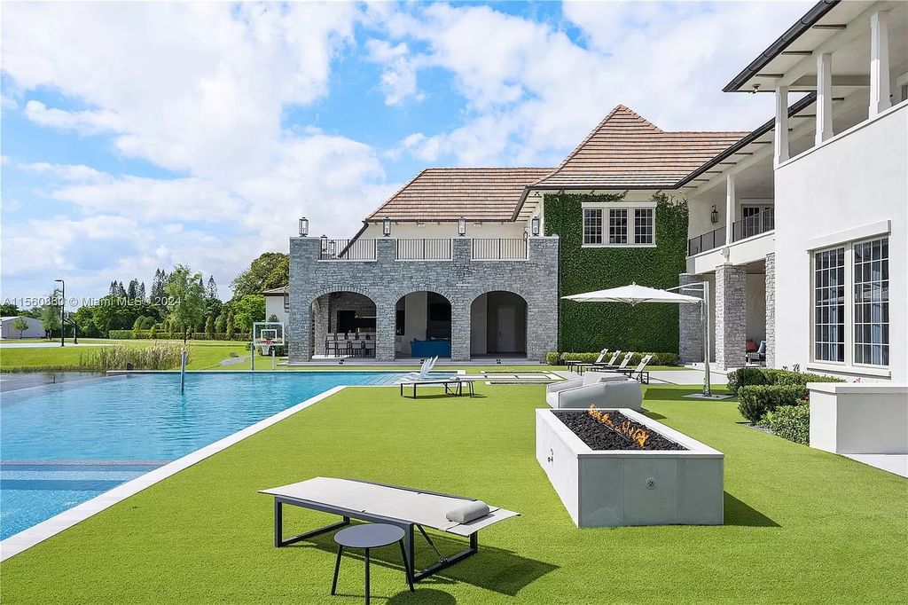 Indulge in the pinnacle of luxury with this custom French Country style mansion in Southwest Ranches, boasting over 15,000 square feet of meticulously crafted living space.