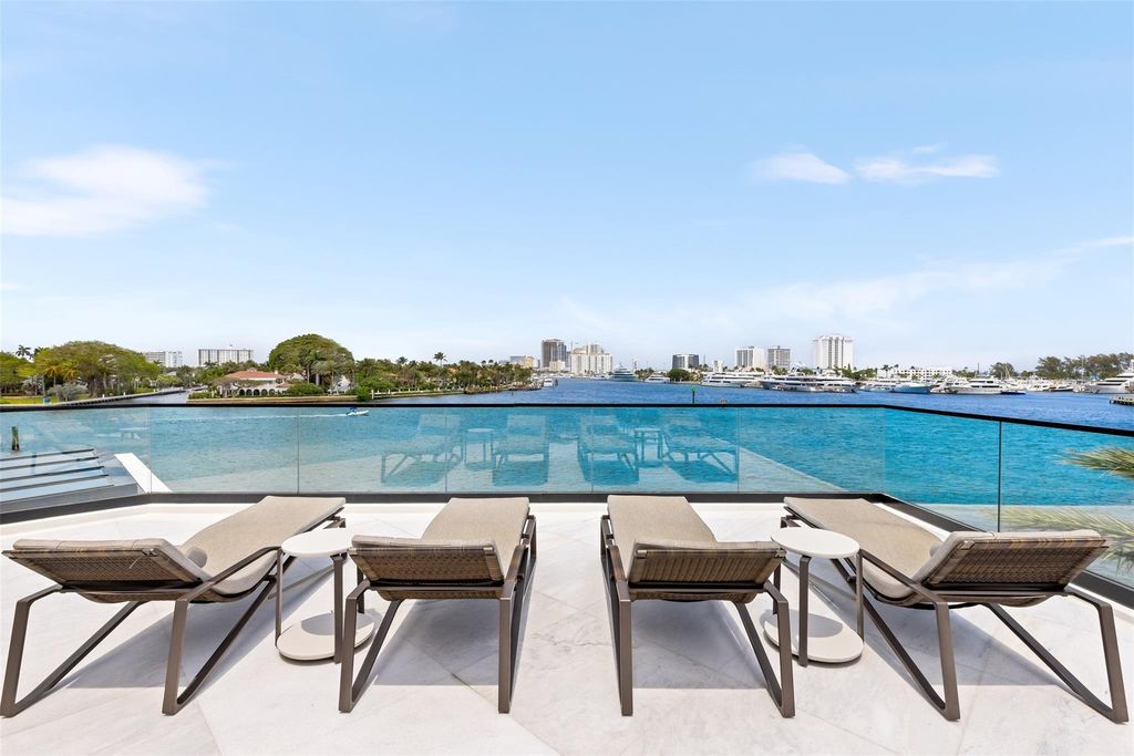 Experience the epitome of luxury living in Fort Lauderdale's prestigious Harbor Beach enclave with this exquisite estate boasting stunning Intracoastal views and 298 feet of water frontage.