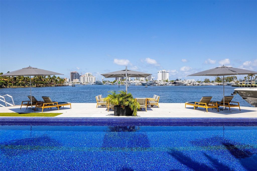 Experience the epitome of luxury living in Fort Lauderdale's prestigious Harbor Beach enclave with this exquisite estate boasting stunning Intracoastal views and 298 feet of water frontage.