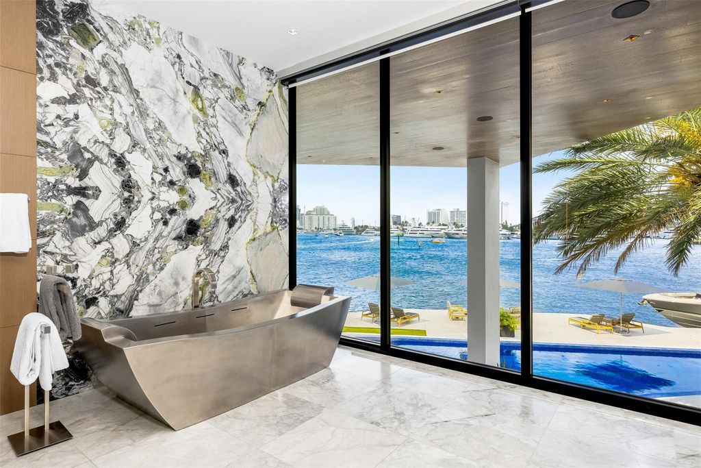 Experience the epitome of luxury living in Fort Lauderdale's prestigious Harbor Beach enclave with this exquisite estate boasting stunning Intracoastal views and 298 feet of water frontage.