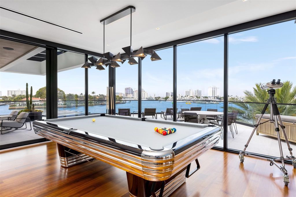 Experience the epitome of luxury living in Fort Lauderdale's prestigious Harbor Beach enclave with this exquisite estate boasting stunning Intracoastal views and 298 feet of water frontage.