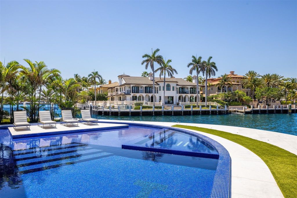 Experience the epitome of luxury living in Fort Lauderdale's prestigious Harbor Beach enclave with this exquisite estate boasting stunning Intracoastal views and 298 feet of water frontage.