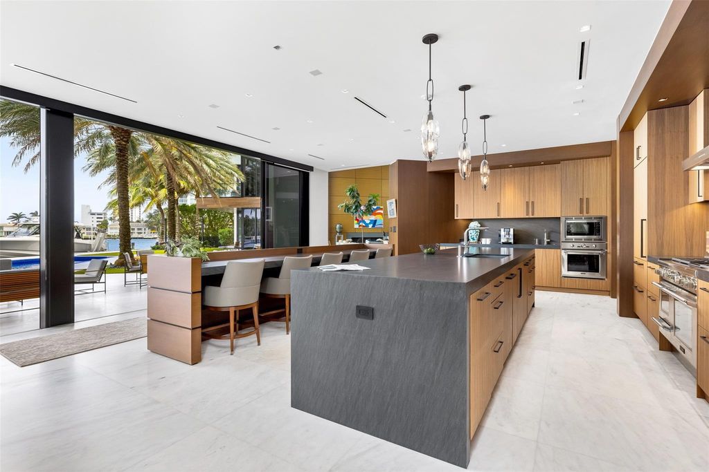 Experience the epitome of luxury living in Fort Lauderdale's prestigious Harbor Beach enclave with this exquisite estate boasting stunning Intracoastal views and 298 feet of water frontage.