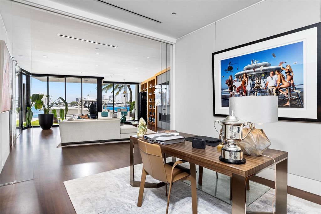 Experience the epitome of luxury living in Fort Lauderdale's prestigious Harbor Beach enclave with this exquisite estate boasting stunning Intracoastal views and 298 feet of water frontage.