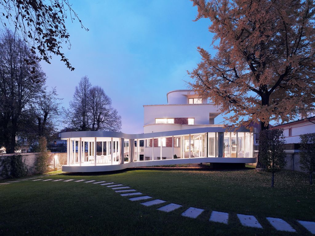 Ring House, Interwar Classic to Oasis by OFIS Architects