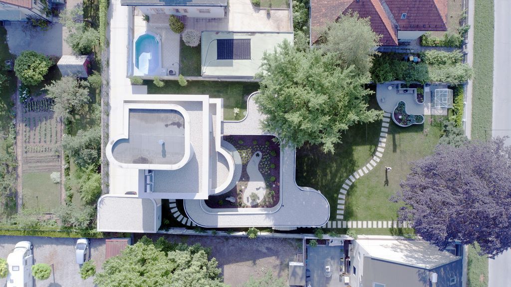 Ring House, Interwar Classic to Oasis by OFIS Architects