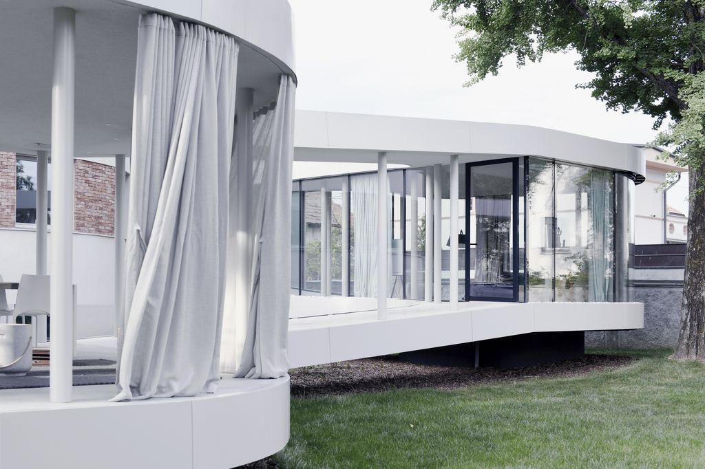 Ring House, Interwar Classic to Oasis by OFIS Architects