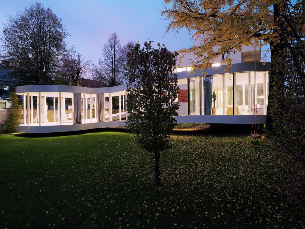 Ring House, Interwar Classic to Oasis by OFIS Architects