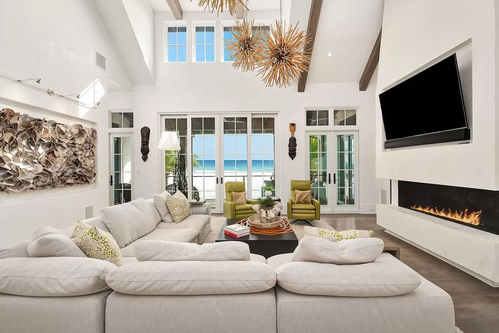 This meticulously crafted masterpiece boasts a seamless blend of indoor and outdoor spaces, offering unparalleled views of the azure waters.