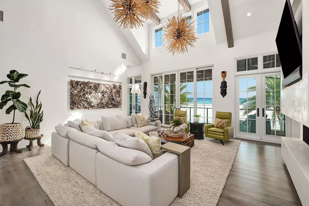 This meticulously crafted masterpiece boasts a seamless blend of indoor and outdoor spaces, offering unparalleled views of the azure waters.