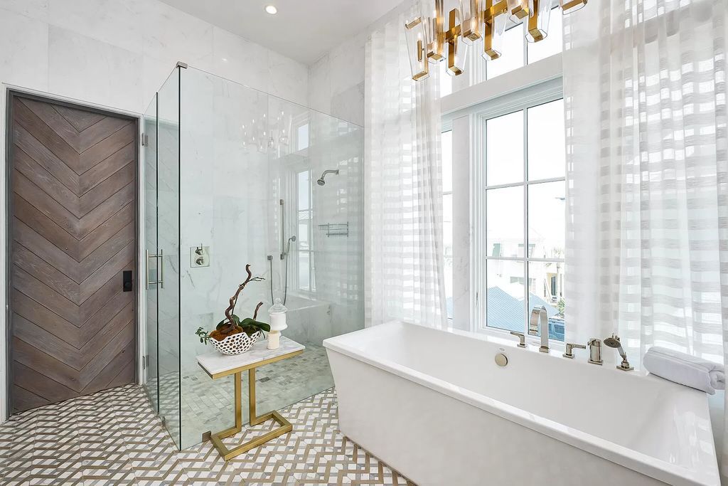 This meticulously crafted masterpiece boasts a seamless blend of indoor and outdoor spaces, offering unparalleled views of the azure waters.