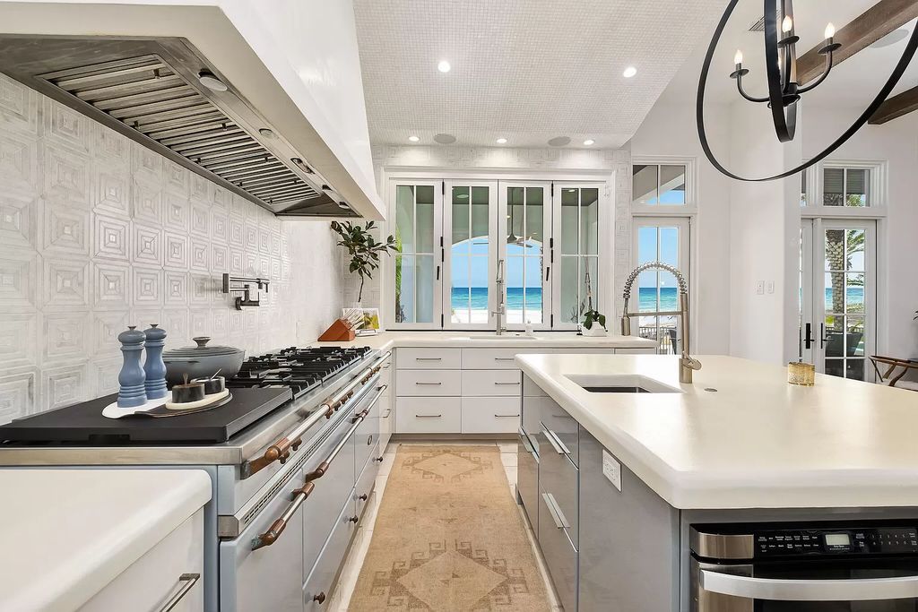 This meticulously crafted masterpiece boasts a seamless blend of indoor and outdoor spaces, offering unparalleled views of the azure waters.