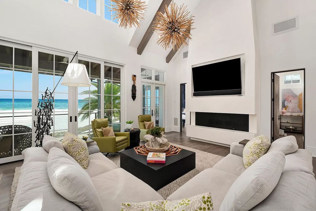 This meticulously crafted masterpiece boasts a seamless blend of indoor and outdoor spaces, offering unparalleled views of the azure waters.