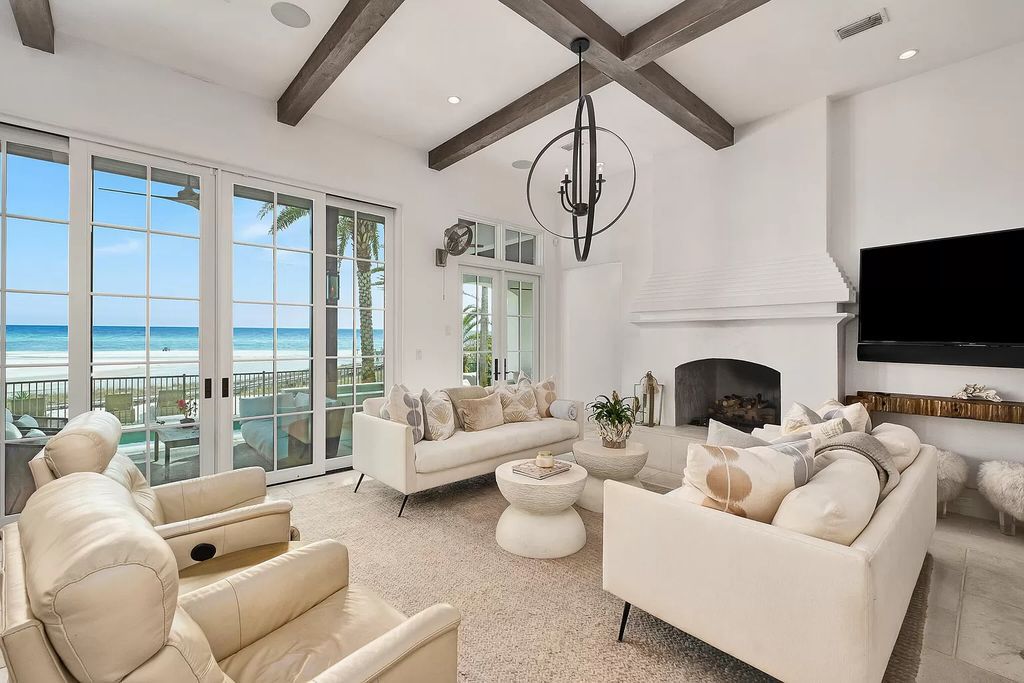 This meticulously crafted masterpiece boasts a seamless blend of indoor and outdoor spaces, offering unparalleled views of the azure waters.