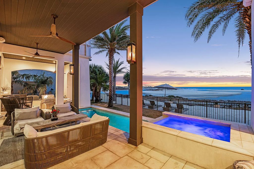 This meticulously crafted masterpiece boasts a seamless blend of indoor and outdoor spaces, offering unparalleled views of the azure waters.
