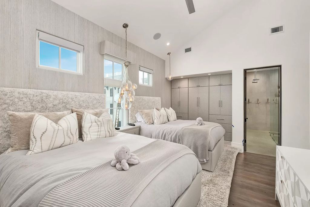 This meticulously crafted masterpiece boasts a seamless blend of indoor and outdoor spaces, offering unparalleled views of the azure waters.