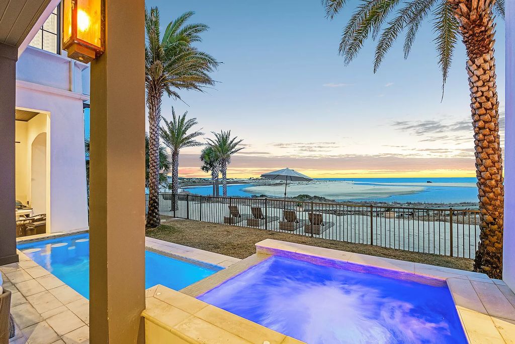 This meticulously crafted masterpiece boasts a seamless blend of indoor and outdoor spaces, offering unparalleled views of the azure waters.