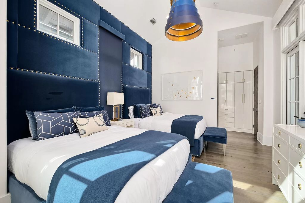This meticulously crafted masterpiece boasts a seamless blend of indoor and outdoor spaces, offering unparalleled views of the azure waters.