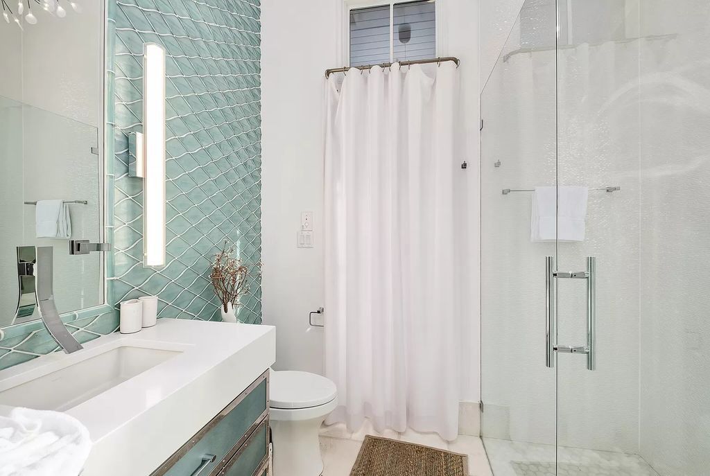 This meticulously crafted masterpiece boasts a seamless blend of indoor and outdoor spaces, offering unparalleled views of the azure waters.