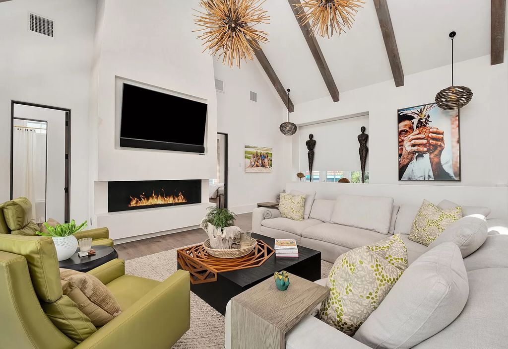 This meticulously crafted masterpiece boasts a seamless blend of indoor and outdoor spaces, offering unparalleled views of the azure waters.