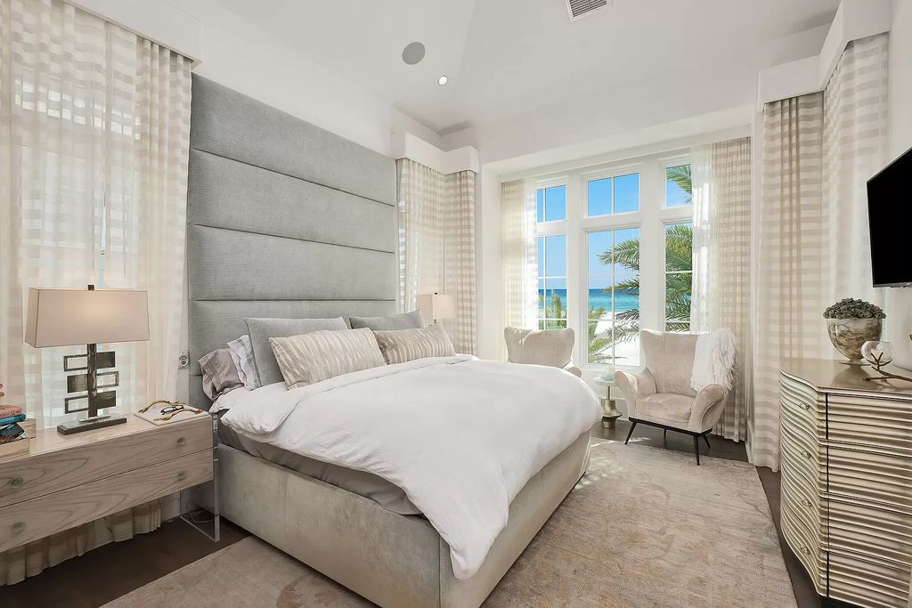This meticulously crafted masterpiece boasts a seamless blend of indoor and outdoor spaces, offering unparalleled views of the azure waters.