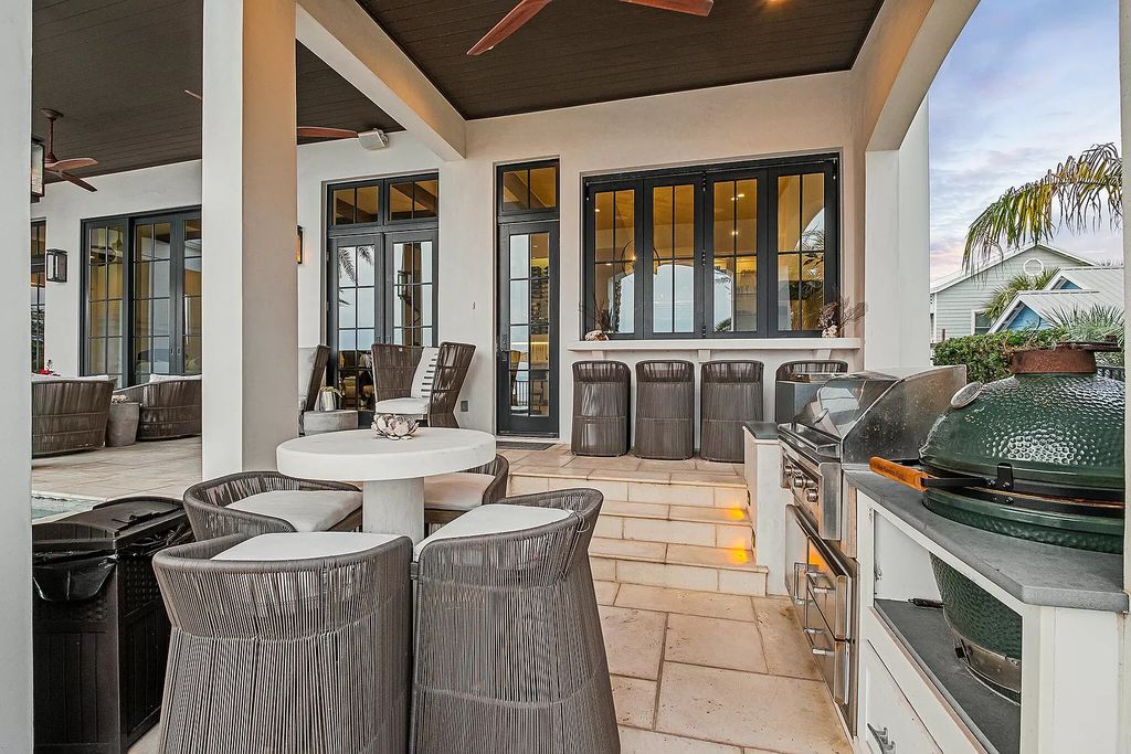 This meticulously crafted masterpiece boasts a seamless blend of indoor and outdoor spaces, offering unparalleled views of the azure waters.