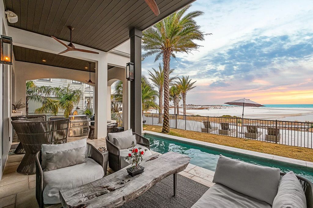 This meticulously crafted masterpiece boasts a seamless blend of indoor and outdoor spaces, offering unparalleled views of the azure waters.